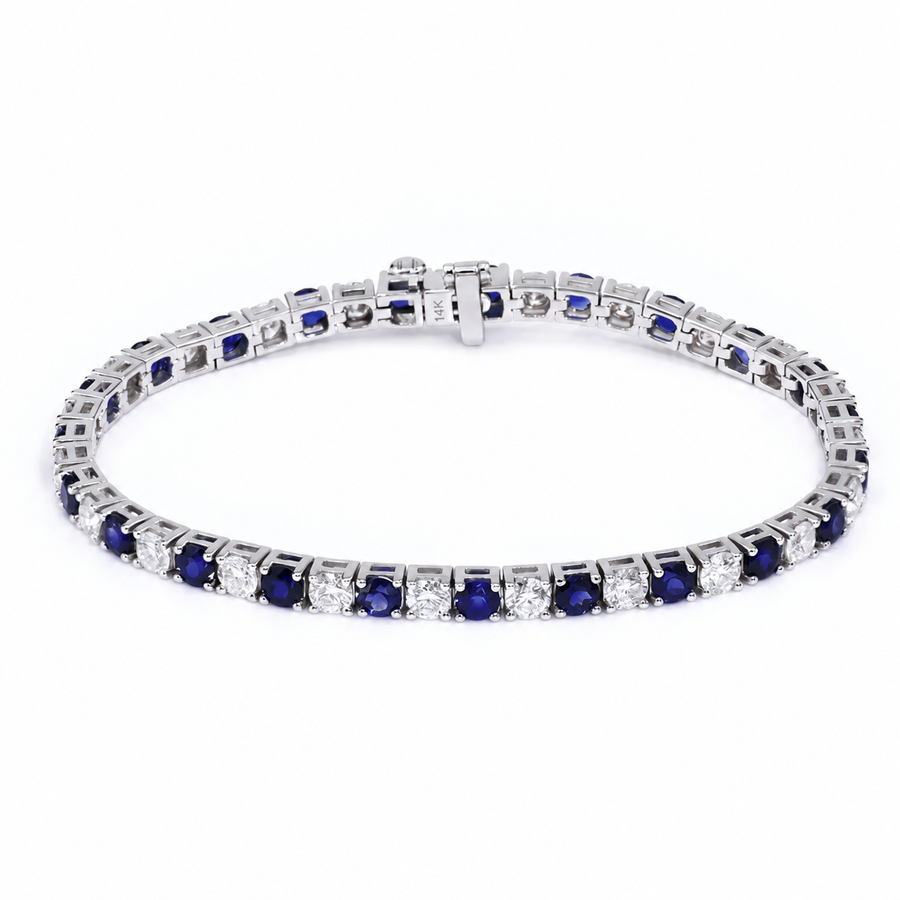 Blue-and-white tennis bracelet with alternating round stones in white-metal settings.