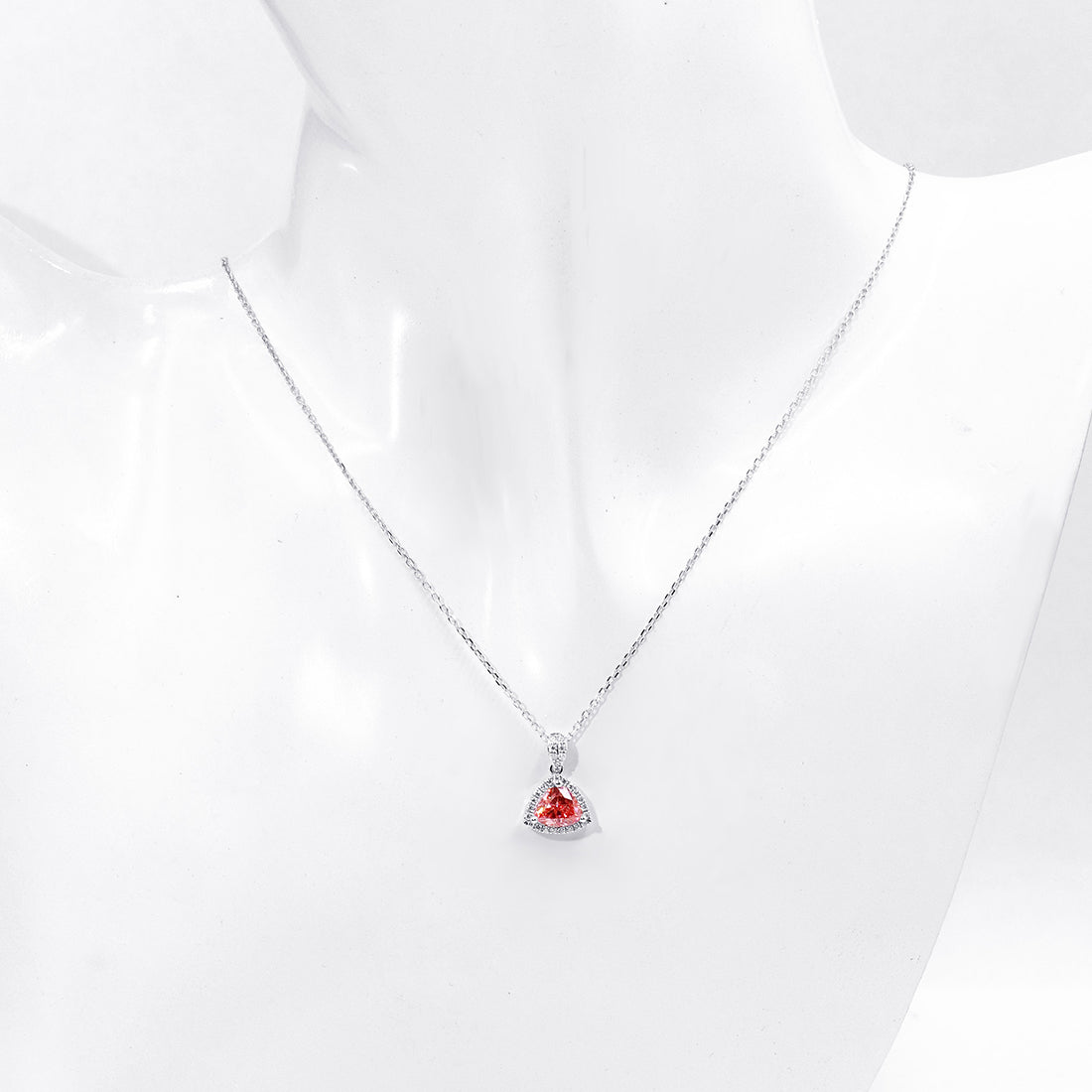Pink trillion halo necklace displayed on a white bust