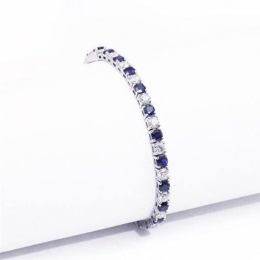 Side view of the articulated blue and clear stone bracelet