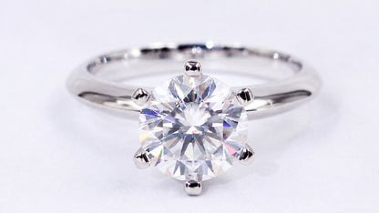 Front view of the round moissanite and polished band