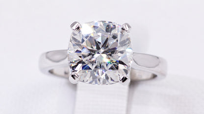 Front view of the cushion-cut moissanite and polished band