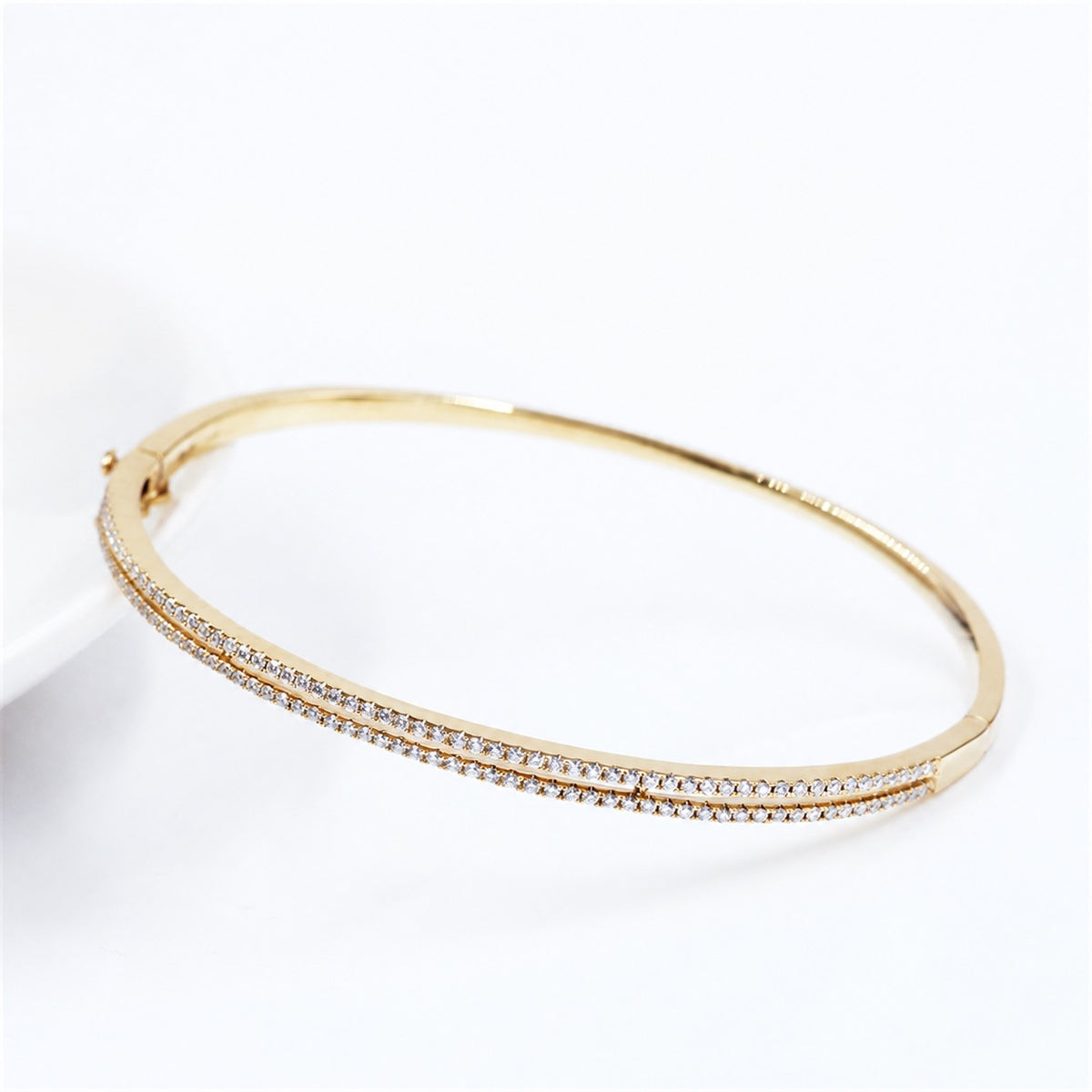 Pavé bangle shown open at its hinge