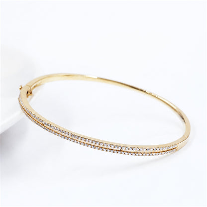 Pavé bangle shown open at its hinge