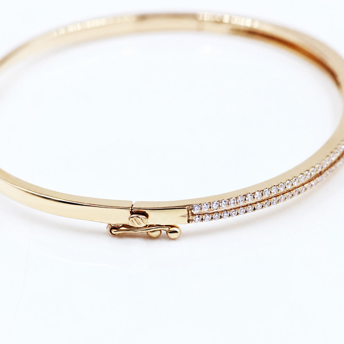 Close view of the bangle clasp and pavé setting