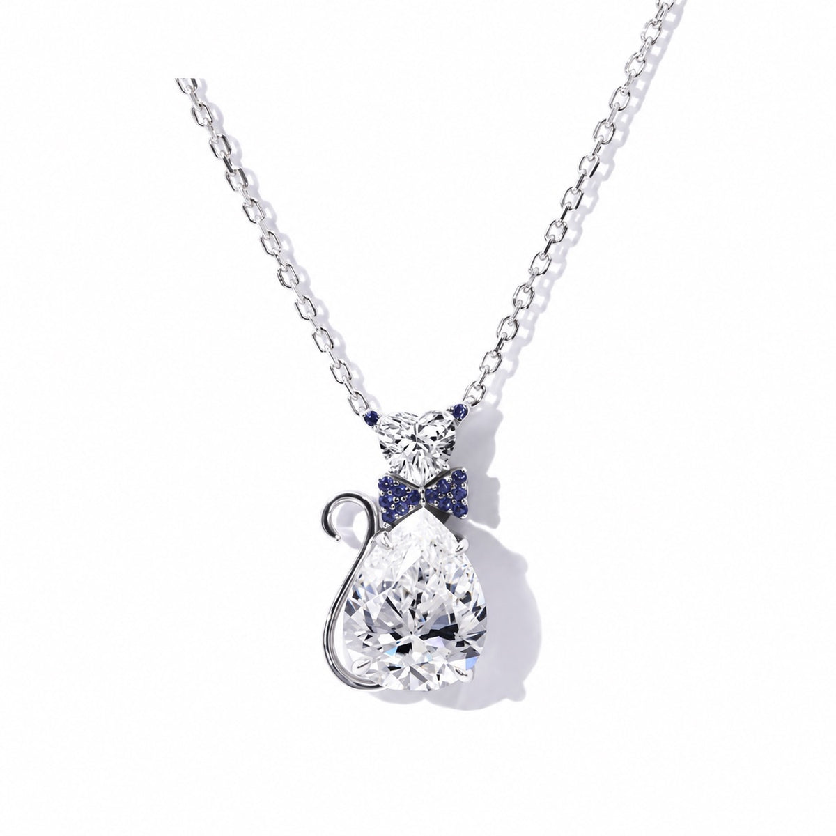 White gold moissanite cat pendant with a curled tail