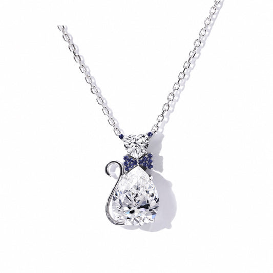 White gold moissanite cat pendant with a curled tail