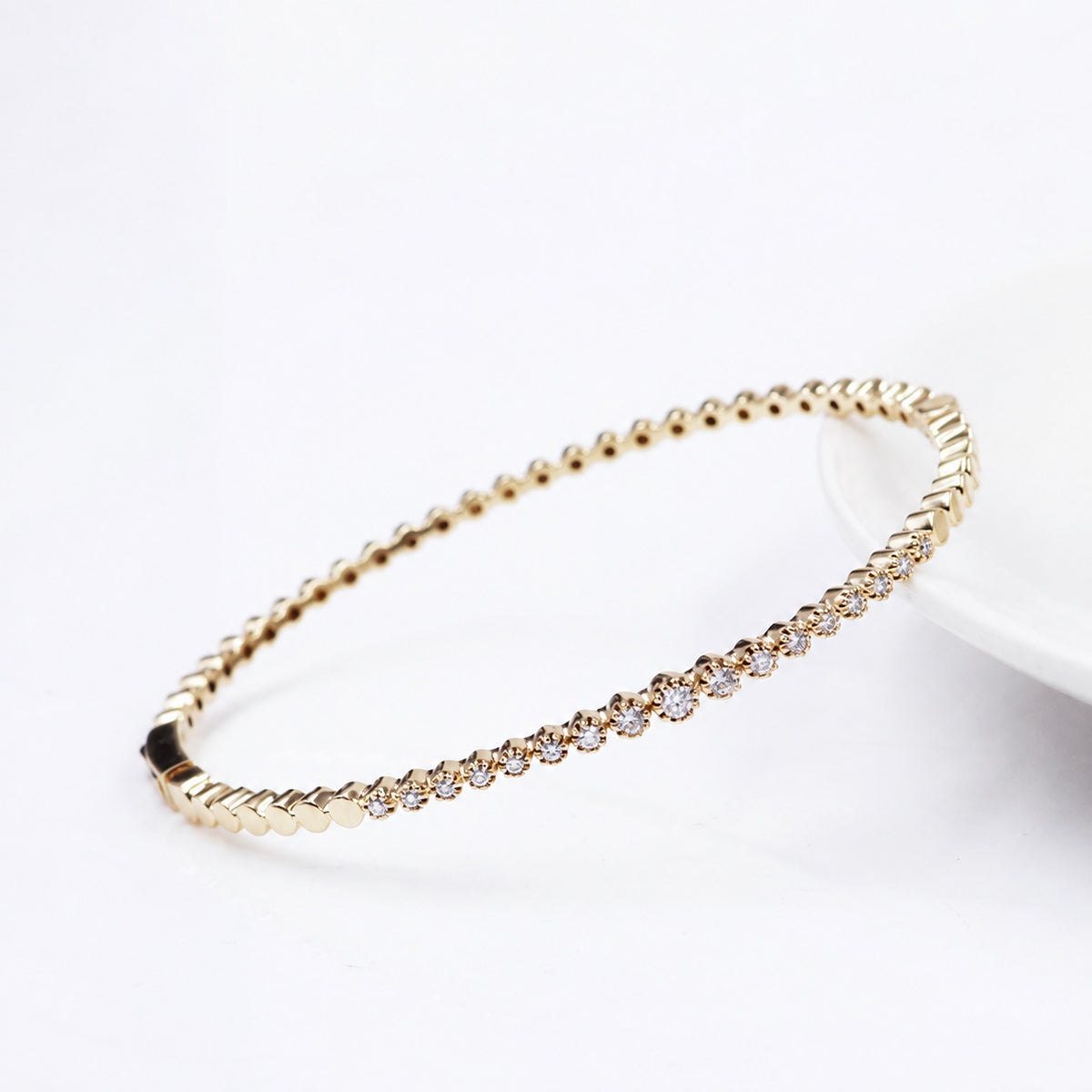 Angled view of the fine linked moissanite bracelet