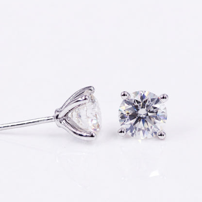 Round brilliant moissanite earrings showing front and side