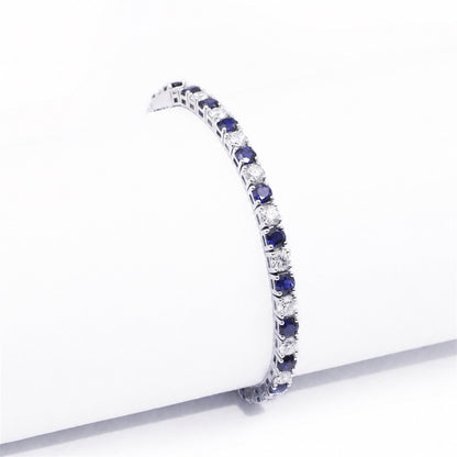 Side view of the articulated blue and clear stone bracelet