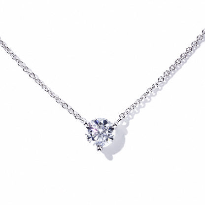 Round moissanite necklace in an 18K white gold three-prong setting