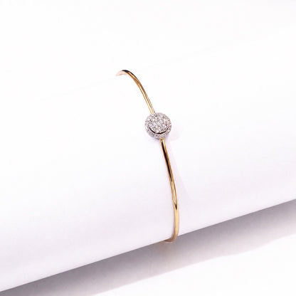 Open moissanite cuff displayed upright on a white block