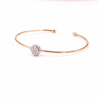 Two-tone gold cuff with a round moissanite cluster