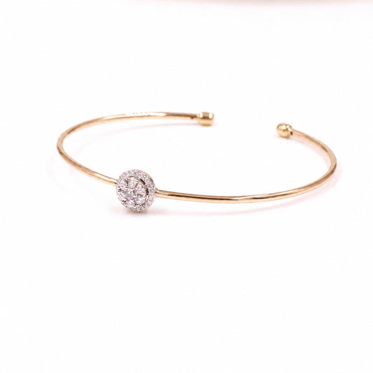 Two-tone gold cuff with a round moissanite cluster
