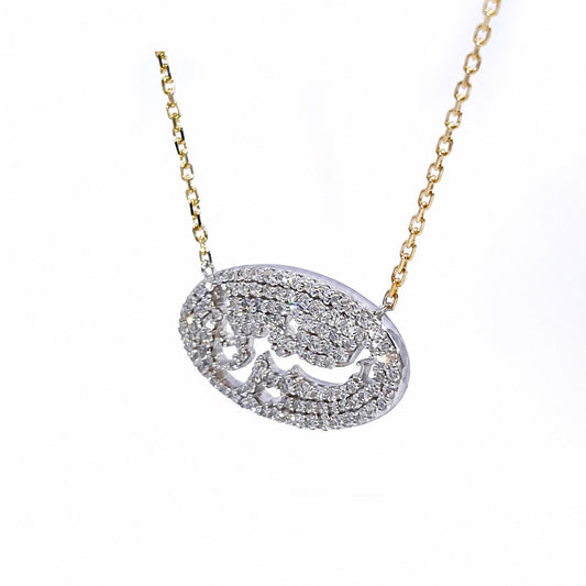 Angled view of the oval openwork lettering and diamond border