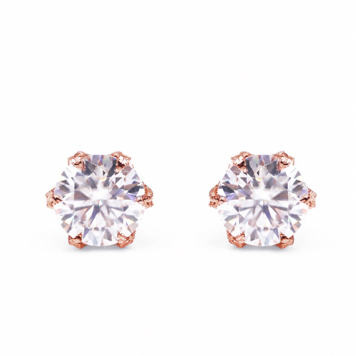 Round moissanite rose gold studs, front view