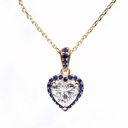 Heart moissanite necklace surrounded by a royal-blue sapphire halo