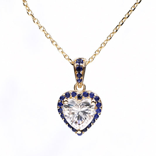 Heart moissanite necklace surrounded by a royal-blue sapphire halo