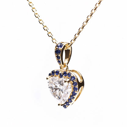 Angled view of the heart pendant in yellow gold