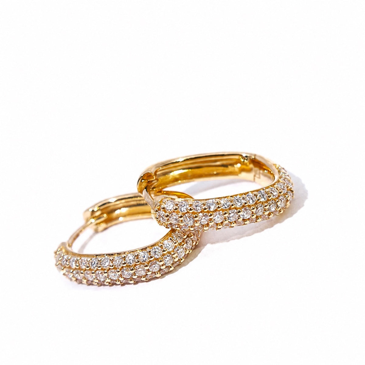 Diamond hoop earrings showing their rounded surface