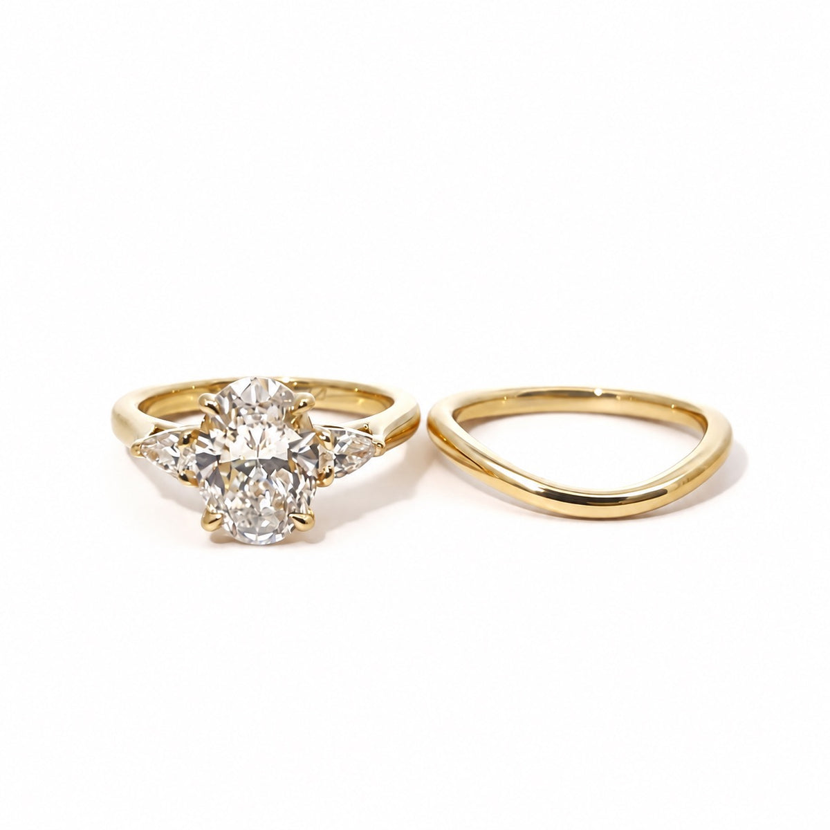Engagement ring and matching plain band displayed separately