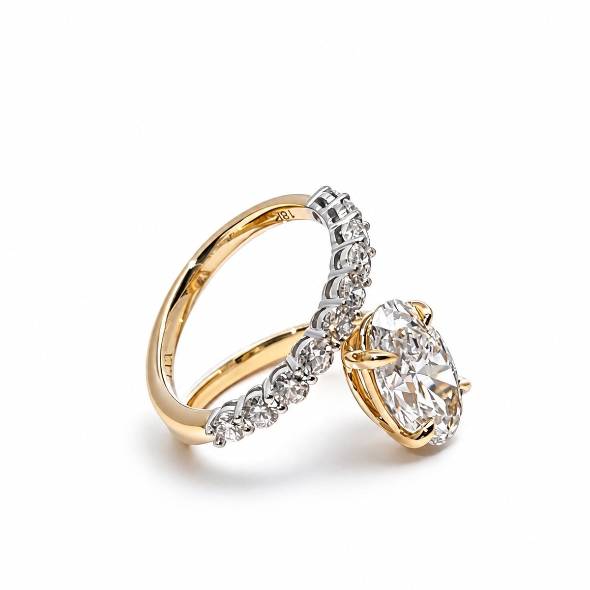 Angled view of the oval lab diamond and accent band