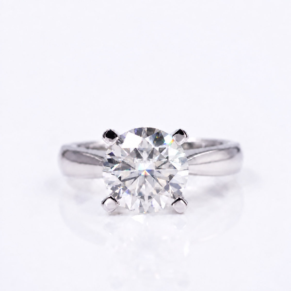 Cushion moissanite solitaire ring with four prongs