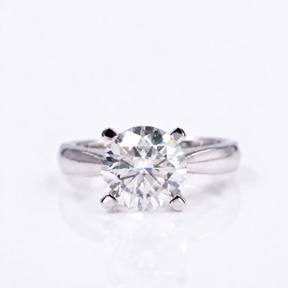 Cushion moissanite solitaire ring with four prongs