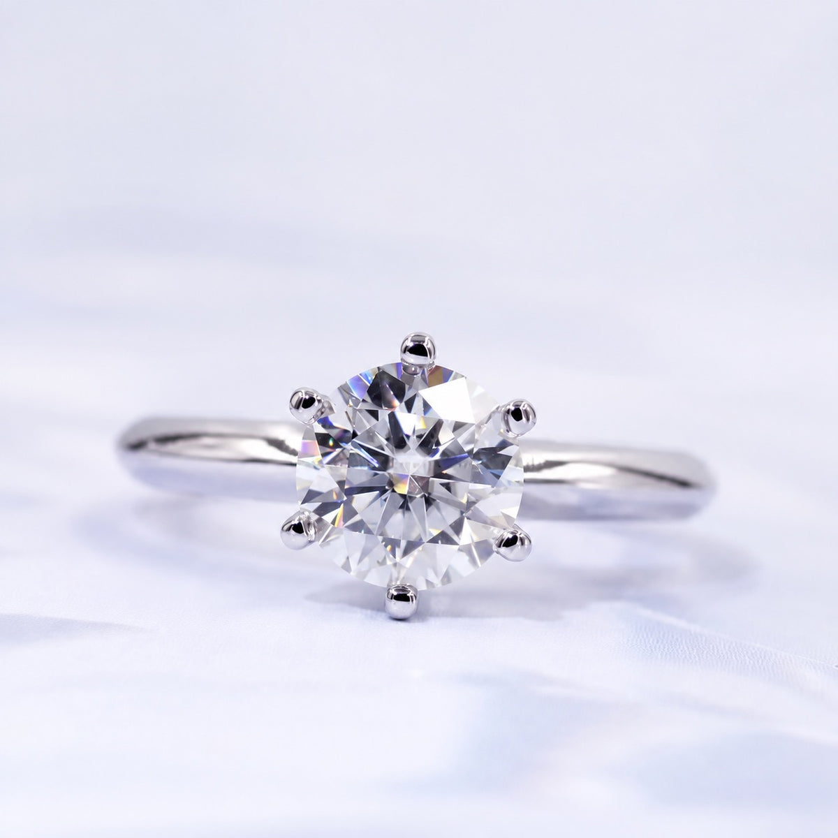 Round moissanite solitaire ring with a six-prong setting