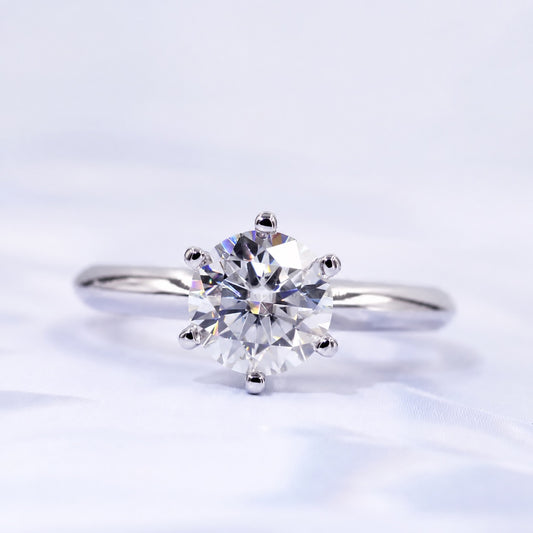 Round moissanite solitaire ring with a six-prong setting