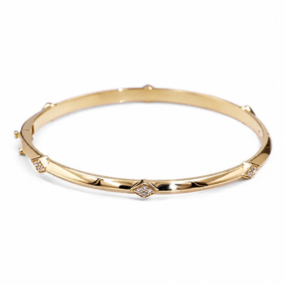 14k yellow gold bangle with diamond-set lozenge motifs